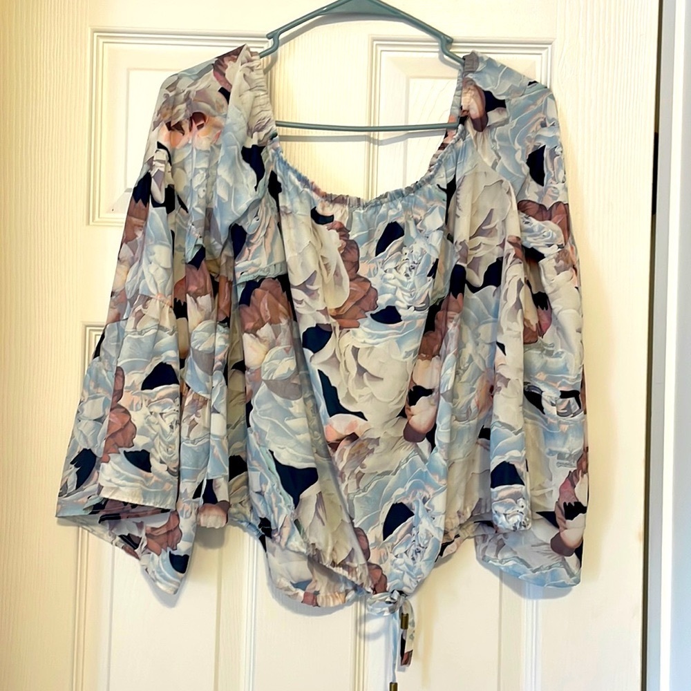 Off the shoulder blouse. With tie around waist.